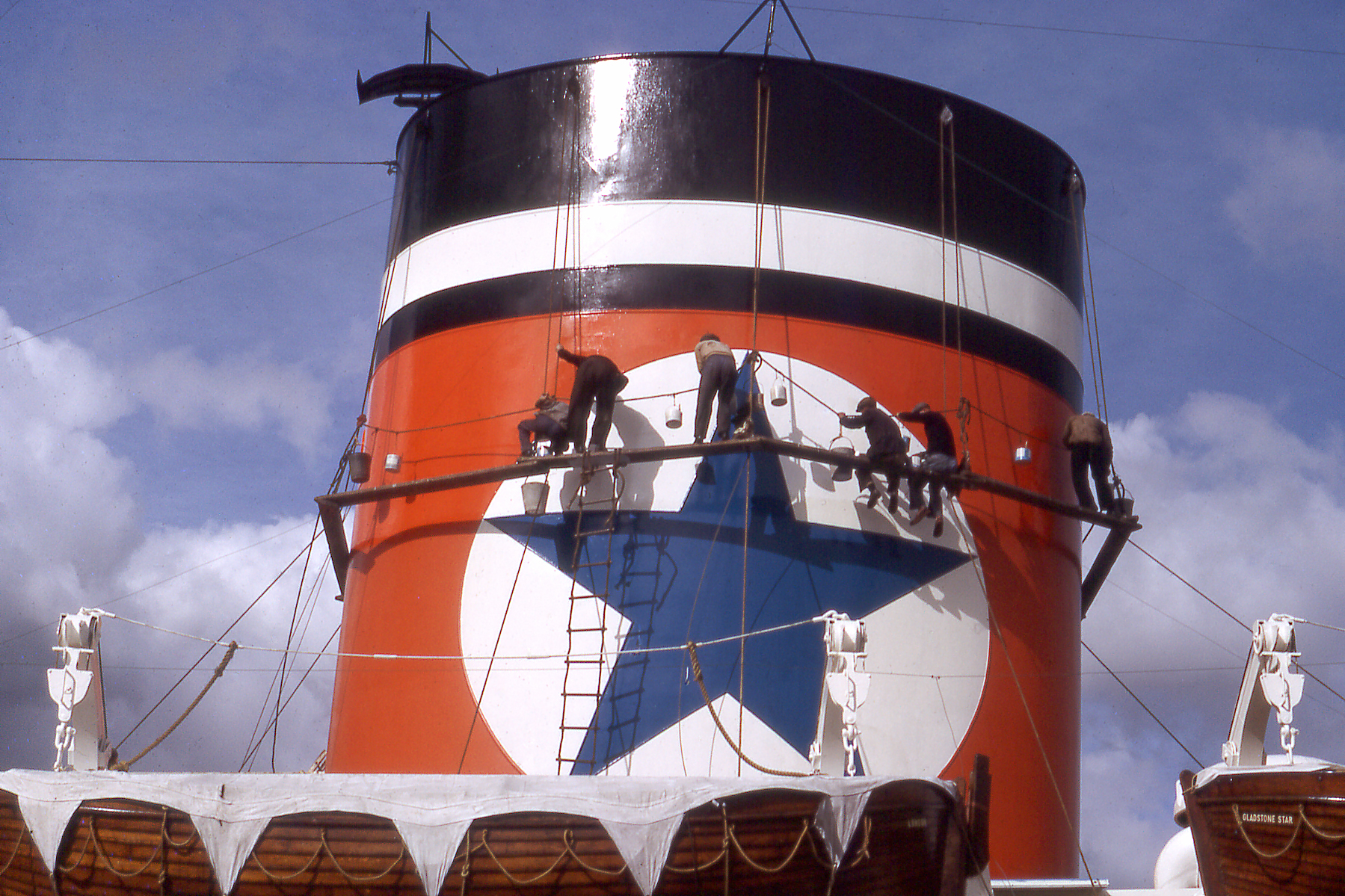 Crew painting the funnel of British cargo liner Gladstone Star in Hobart, April 1966 (Rex Cox)