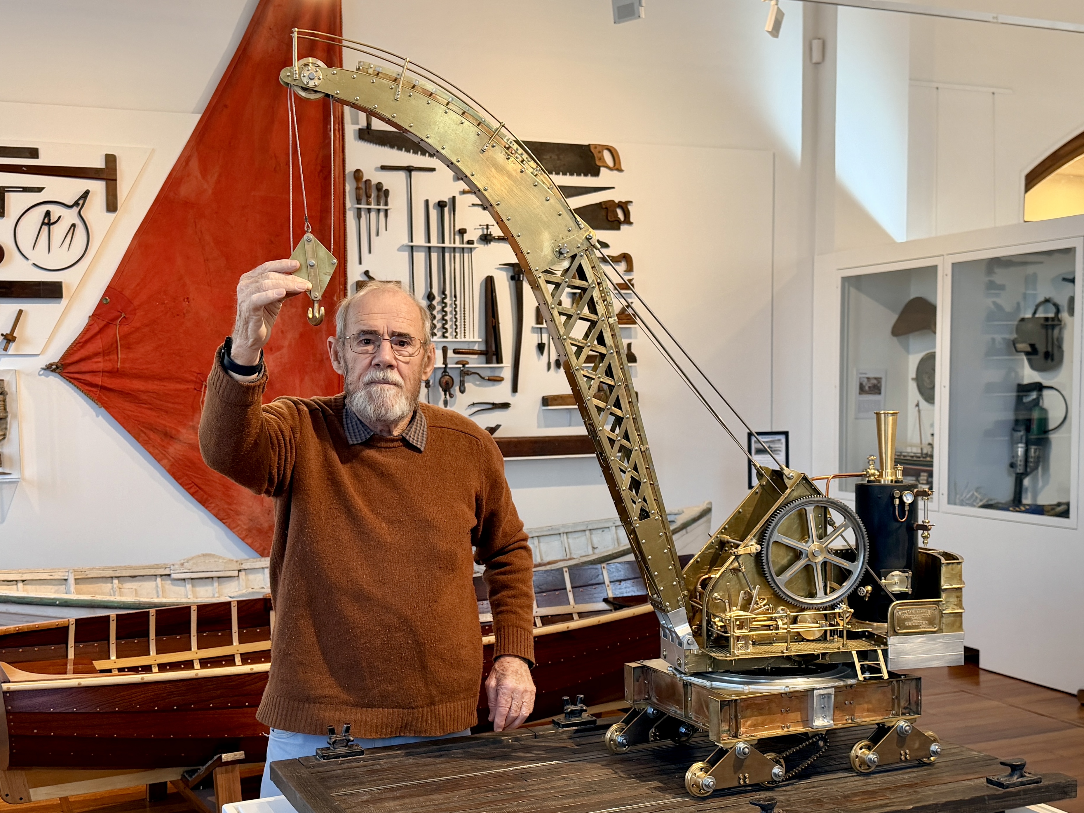Dr Tony Sprent AM with his hand-crafted steam crane model